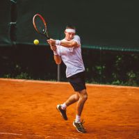Man playing tennis, symbolizing opening the platform to new ideas